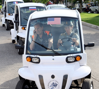Illustration for article titled G8 Leaders Look Silly Shuttled Around In GEM Electric Cars